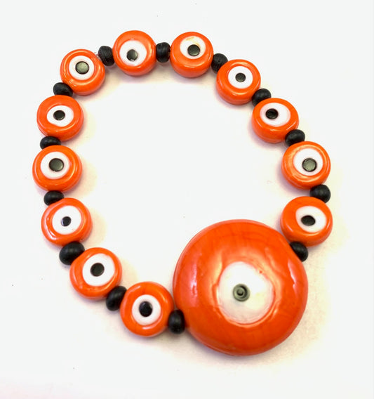 Orange eye glass bead bracelet